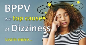 woman holding her head with dizziness due to BPPV