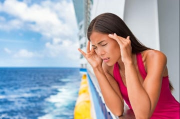 woman feeling rocking dizziness from mal de debarquement after cruise ship vacation